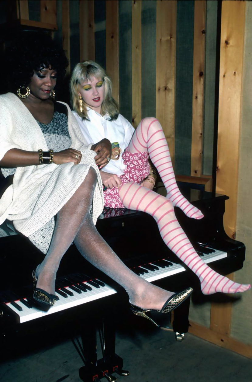 l-r-singers-patti-labelle-and-cyndi-lauper-sitting-on-piano-1996-ann-clifford.jpeg